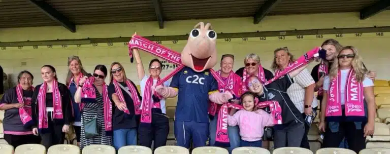 How a scarf included in the welcome fits an initiative introducing women to their local football club.